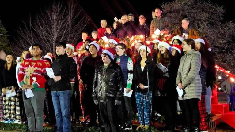 The West Milford High School Concert Choir sings Christmas carols during the tree lighting ceremony. (Photo by Rich Adamonis)