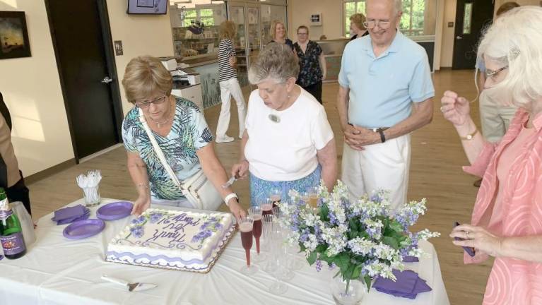 The ceremony include a cake and other celebratory refreshments.