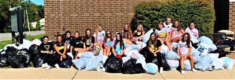 Cheerleaders gather 3,700 lbs of clothing during recent drive
