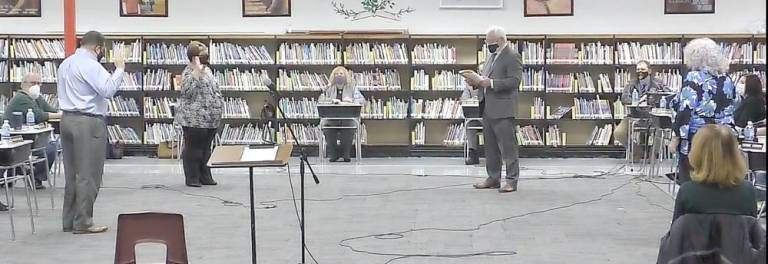 School Board Attorney Andrew Brown administered the oath of office to Trustees Raymond Guarino, Lynda Van Dyk and Debbie O’Brien at the West Milford Board of Education annual reorganization meeting on Jan. 5.