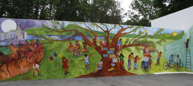 The Summer of a lifetime This mural was painted last year and is on the property of Hands In 4 Youth. It shows the history of the camp, from its days 90 years ago in Kingston, N.Y., to now.