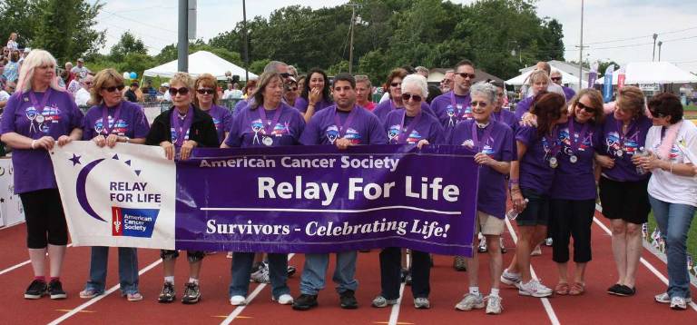 Relay for Life connects the community And the first lap - the survivor's lap - begins and sets the tone for the event. Photo by Ginny Raue
