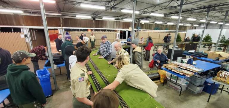 HH1 Boy Scouts help set up a model train display for the German Christmas Market held Dec. 1-3 at the Sussex County Fairgrounds. (Photo courtesy of Jim Hofmann)