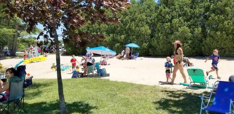 The beach at the Pinecliff Lake Club.