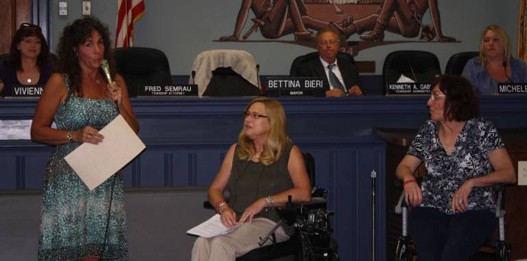 A long road traveled, more to go Photo by Linda Smith Hancharick Mayor Bettina Bieri, left, speaks about the ADA and how the township is recommitting its efforts to fully implement the law. Janice Sangle, center, and Janet Laycox, right, are West Milford residents and advocates for the disabled.