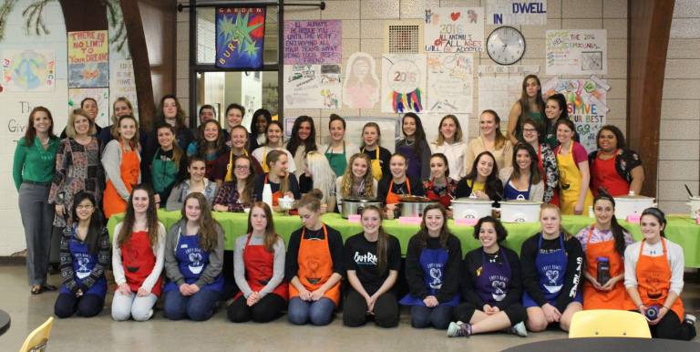 These are the students who ran the Empty Bowls event. They organized, heated and served the soup, sold the tickets, cut the bread and served drinks. They are seen with art teachers Cathleen Cosgrove, Jennifer Monego and Cynthia Gallaugher and culinary arts teacher Danielle Kaiser.