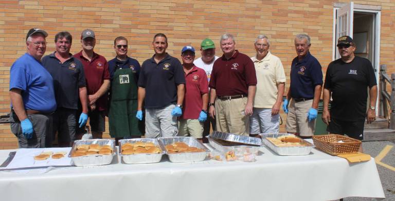 St. Joseph Church welcomes new priest at annual parish picnic The Knights of Columbus, Father Koch Council 6343, prepared to do some cooking. They cooked all of the hot dogs and hamburgers for the picnic. And they were yummy.