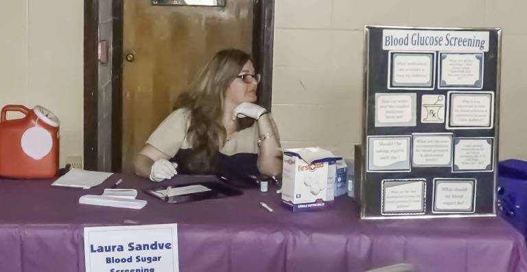 Staying healthy Laura Sandve performed glucose screenings at the health fair.