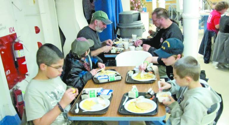 Photos by Patricia Keller The cubs and their parents got to eat in the Mess Hall.