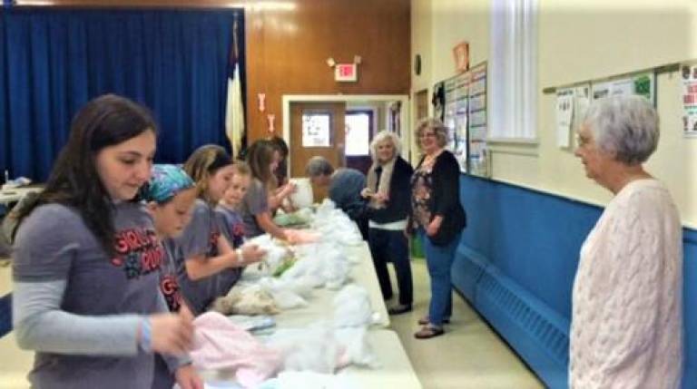 [Members of the On The Run girls' club and the West Milford Woman's Club joined to make 35 stuffed animals for first responders to bring comfort to children impacted during an emergency. Submitted photo]