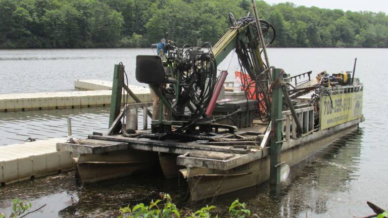 Getting the stumps out A stump boat is removing tree stumps from Greenwood Lake.