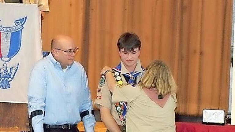 David Braen with his parents at the Eagle Scout ceremony