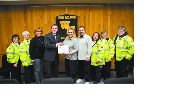 West Milford High School senior Stephanie Paul receives President’s Volunteer Service Award With her parents and fellow West Milford First Aid Squad members, Stephanie Paul is honored for her community service. From left, Sue Pappas, Bev Lujbli, Laura Paul, West Milford High School Principal Paul Gorski, Stephanie, Jimmy Paul, Dolores Serpe, Rose Lewis and Ken Cuneo.