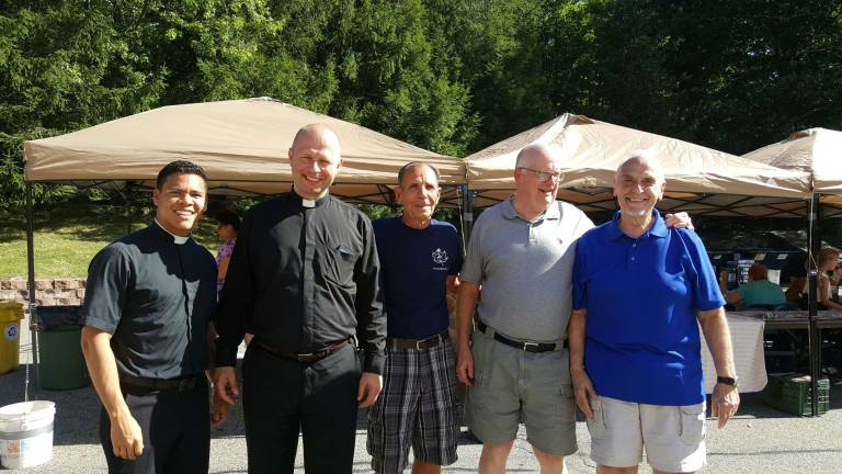 St. Joseph Church welcomes new priest at annual parish picnic From left, Deacon Henry Pinto, Fr. Aleksander Bialas, Harry Adams, Deacon Harry White and Deacon Ben LoParo take a moment at the parish picnic.