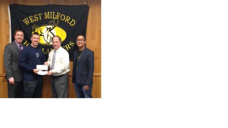 From left, West Milford High School Principal Paul Gorski, Harry Van Dyke, Steve Rajczyk of AAA, and West Milford High School teacher Michael Padilla. Harry Van Dyke won first place in the AAA poster contest and was selected best overall high school entry.