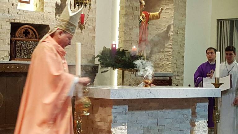 Bishop consecrates new altar at Our Lady Queen of Peace Bishop Arthur J. Serratelli annoints the new stone altar at Our Lady Queen of Peace Church in Hewitt.