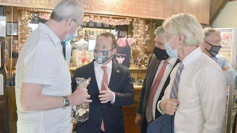 Millions clawed back to improve broadband U.S. Rep. Gottheimer with state and local officials on May 21 at the Chocolate Goat in Lafayette (Photo provided)