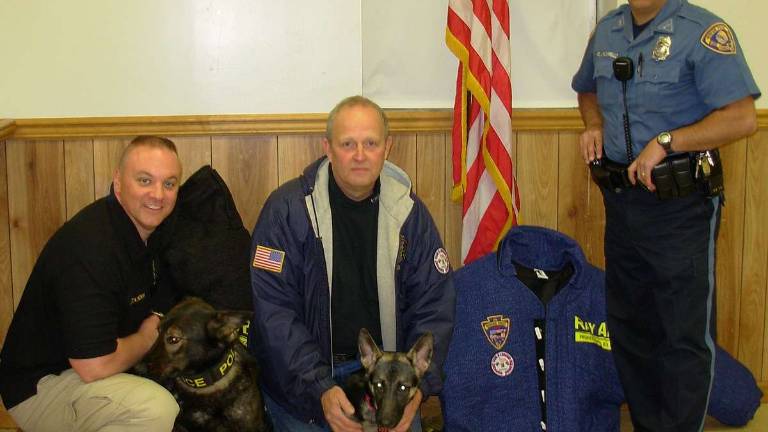 Officers donate equipment to military working dogs Officers donate equipment to military working dogs