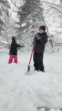 SN1 Olivia Padilla of West Milford throws a snowball at her brother Victor on Tuesday, Feb. 13. (Photo by Rich Adamonis)