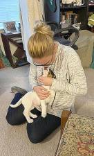 Amelia Moller with the 10-month-old mini-dachshund, mini-Australian shepherd mix she and her husband named Fogarty or Fogs. Fogs was adopted from a shelter in Tennessee. Provided photos.