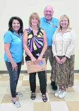 Pictured from left are Sponsor Barbara Corsaro, Flo McClellan, Club President James Kenny, and Lions District Governor SuzAnne Pacala