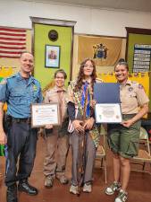 From left are West Milford Police Lt. Eric Darnsteadt, Scoutmaster Danielle Mazzaro, new Eagle Scout Isabella Rupprecht and Jessica Fajardo, field director at Scouting America’s Northern New Jersey Council at an Eagle Court of Honor on May 18. Rupprecht is the second girl in Troop 44G to become an Eagle Scout. For her project, she created a pollinator habitat at the Tenafly Nature Center. She has 138 merit badges and is hoping to earn them all. (Photo provided)