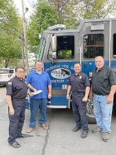 The Upper Greenwood Lake. Volunteer Fire Company held a fund raiser for firefighter Jared Lloyd of the Spring Valley Columbian Engine Company who lost his life helping to evacuate residents at a massive fire at the Evergreen Court Home for Adults. Pictured from left to right are: U.G.L. President Bob Bartilucci, Columbian Chief Ken Conjura, U.G.L. Chief Kevin Kiel and Columbian President Robert Johnson. Photo provided by Bob Bartilucci.