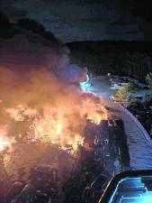 Crews battle large junkyard fire on Weaver Road in West Milford