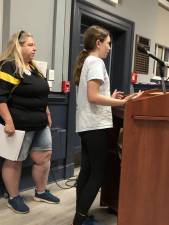 A member of the West Milford Devil Rays swim team speaks to the Township Council on Wednesday, April 19. At left is Rachel Bohmann. (Photo by Kathy Shwiff)
