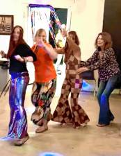 DA1 Fran Lanza, wearing harlequin bell bottoms, takes part in a dance line during the ’70s Dance Night on Saturday, Aug. 23 at the Wallisch Homestead. (Photo by Fred Ashplant)