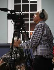 Volunteer cameraman Geoff Belinfante is seen here filming a township council meeting.