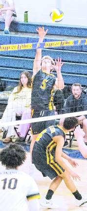 <b>Jefferson's Salvatore Marinello (5) reaches for the ball. Marinello had 1 dig.</b>