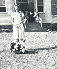 Constance (“Connie”) Struble is seen in her eighth-grade graduation dress outside Echo Lake School where she received her elementary school education through eighth grade. During a winter in the 1940s she was sleigh-riding on Germantown Road and died when her sled collided with a delivery truck. (Photo by Ann Genader)