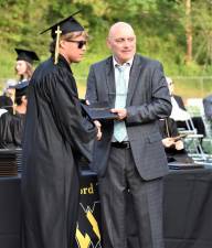A West Milford Township High School graduate receives his diploma Monday, June 19 at McCormack Field. (Photo by Fred Ashplant)