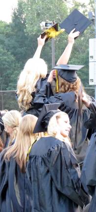 Let the celebration begin! Graduates sat on each other&#146;s shoulders to show their excitement.