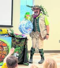 Professor Livingstone (David Engel) takes children on a dinosaur safari.