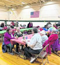 West Milford Senior Citizens enjoyed pizza sponsored by the West Milford Recreation Center and entertainment presented by the Junior High School Choir and band.