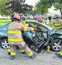 Firefighters demonstrate a vehicle extraction.