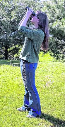 Mary Birrer of the New Jersey Audubon Center watches birds.