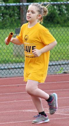 Photo by Justina AddiceSetnee Cornwell nearing the finish line during relay practice.