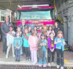 Girl Scout Troop 98821 visits Upper Greenwood Lake Company 5 Fire Dept. to earn badges to learn how to be safe during a fire and how firefighters are courageous and strong.