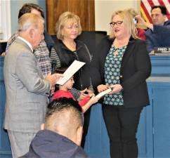 State Sen. Joe Pennacchio, R-26, swears Mayor Michele Dale into her first full, four-year term during the reorganization meeting Monday night.