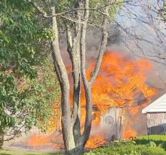 The garage was completely destroyed by the fire, and the cause remains unknown.