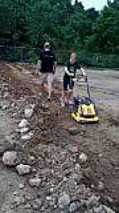 Photo provided Volunteers work at the site of West Milford's pump track. Hopes are it will be completed sometime in September.