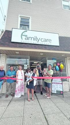 Dr. Nicole Mustafa cuts the ribbon on Family Care Physical Therapy.