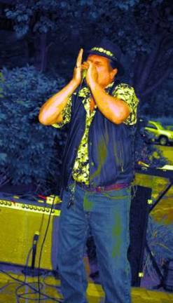 Wailing on the harmonica is Ken Melisky.