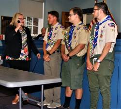 Mayor Michele Dale recognizes the town's three newest Eagle Scouts, Dylan Bednarski, Andrew Borrelli, and Steven Lange, during Wednesday night's Township Council meeting.