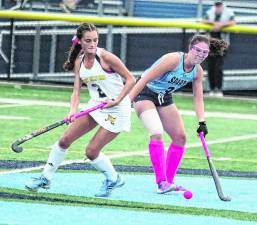 West Milford's Gianna White and Sparta's Cassie Ailara battle for control of the ball.