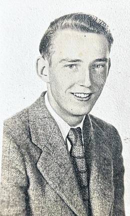 John Andrew Dearing is celebrating his 100th birthday on October 18. He is pictured in 1945 when he graduated from Butler High School.