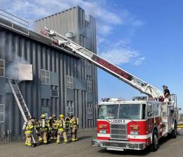 Firefighters from West Milford Company 1 and Company 6 drilling with ladders at the fire training center located at the Passaic County Public Safety Academy in Wayne, N.J. Photos by Anthony Molnar.